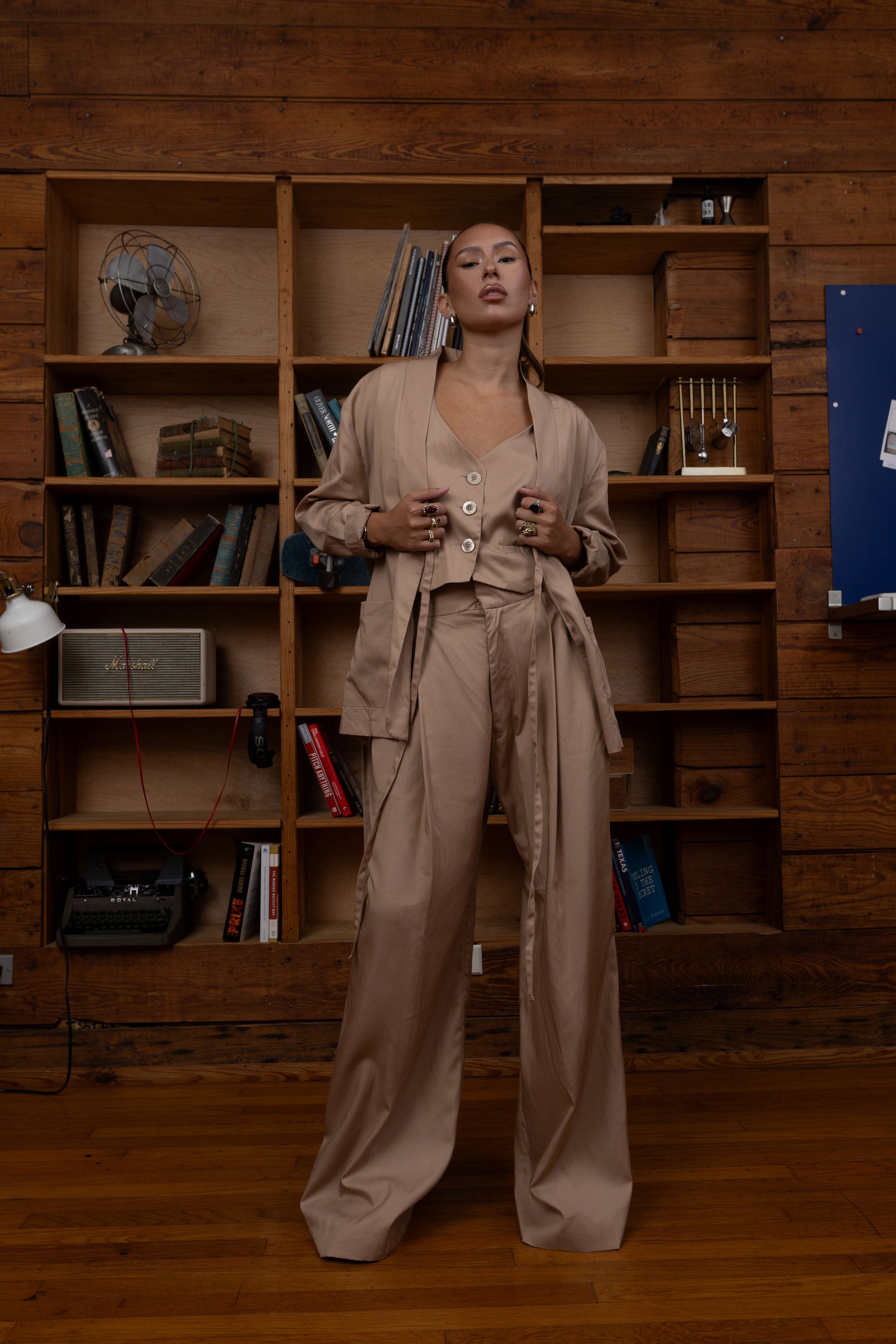 Woman in a beige two piece set outfit, Wide leg pants and vest