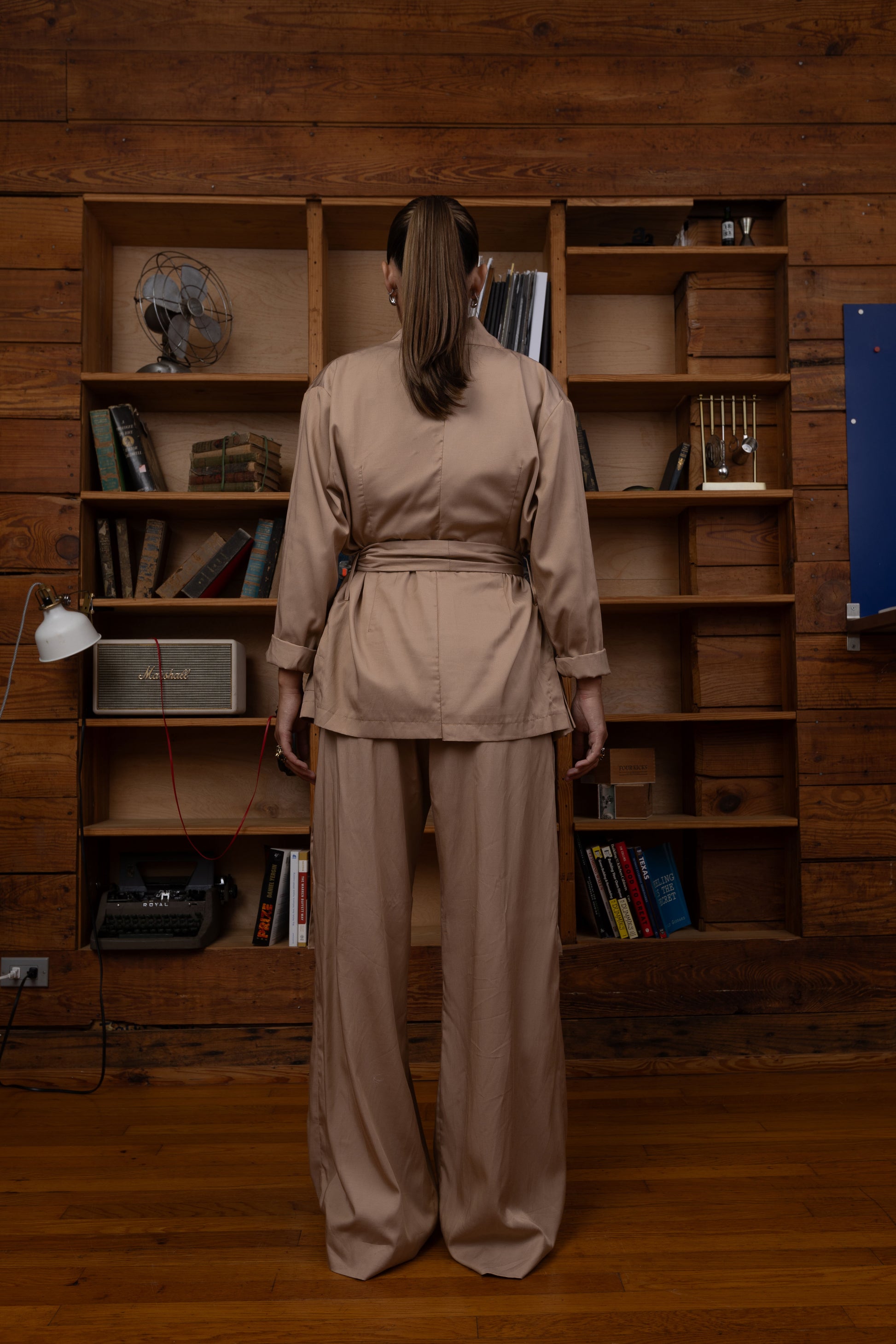Woman in a beige two piece set outfit, Wide leg pants and vest 