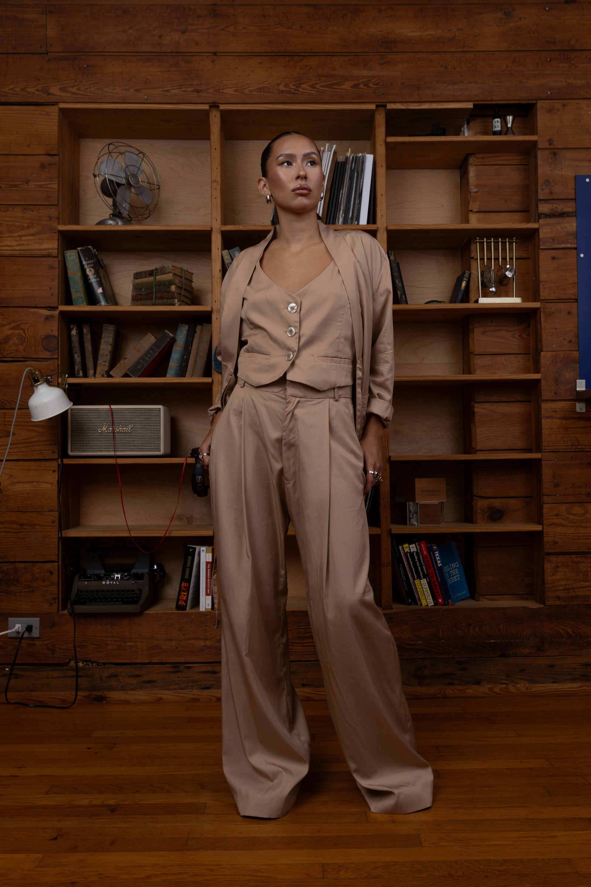 Woman in a beige two piece set outfit, Wide leg pants and vest
